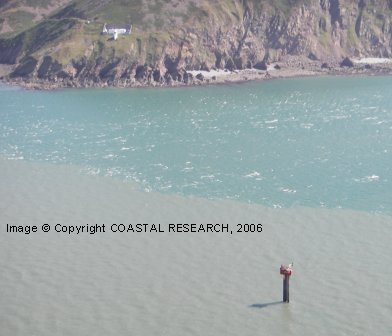 Aerial View of Turbine and Foreland Point Lighthouse also showing the tidal front